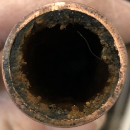 Sludge in pipes preventing hot water from flowing freely through the central heating pipework