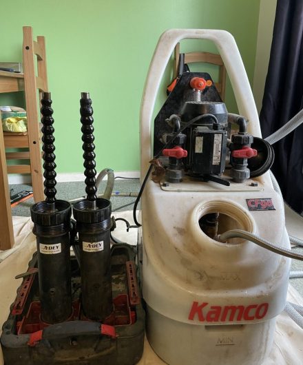 Power flush machine set up with strong magnets to attract sludge